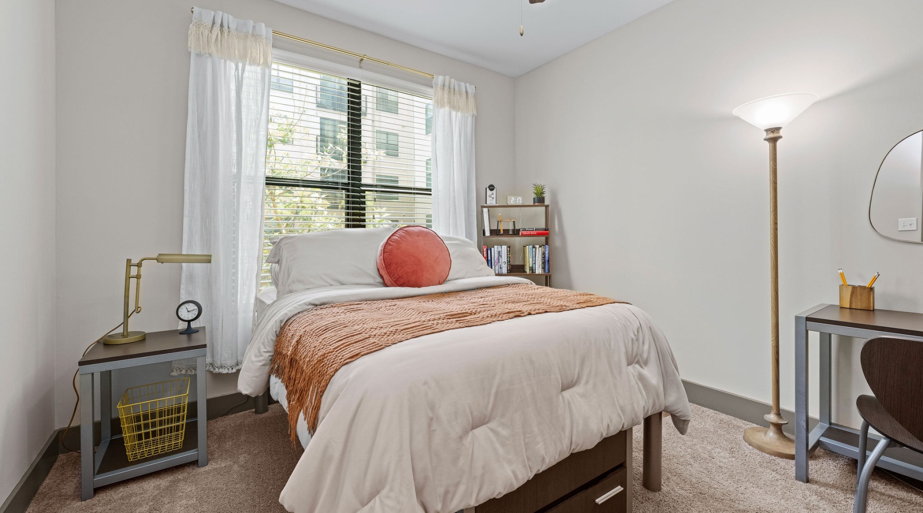 a bedroom with a bed and a table